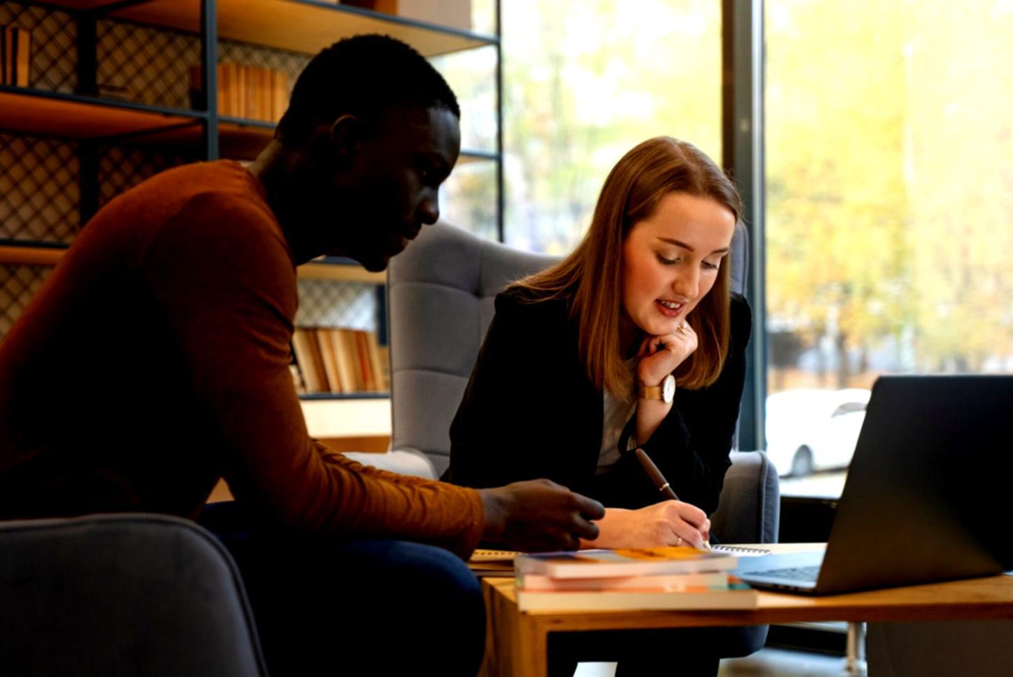 Creative writing workspace with character development charts, story boards, and manuscript pages organized for screenplay planning